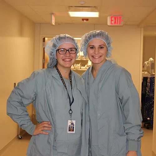 Two Women scrubbing in for surgery
